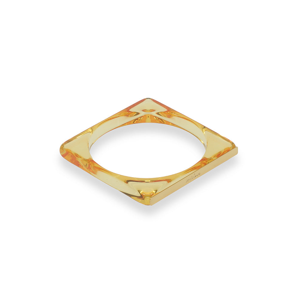 BRACCIALE RIGIDO QUADRATO TRASPARENTE CON PARTICOLARE IN OTTONE