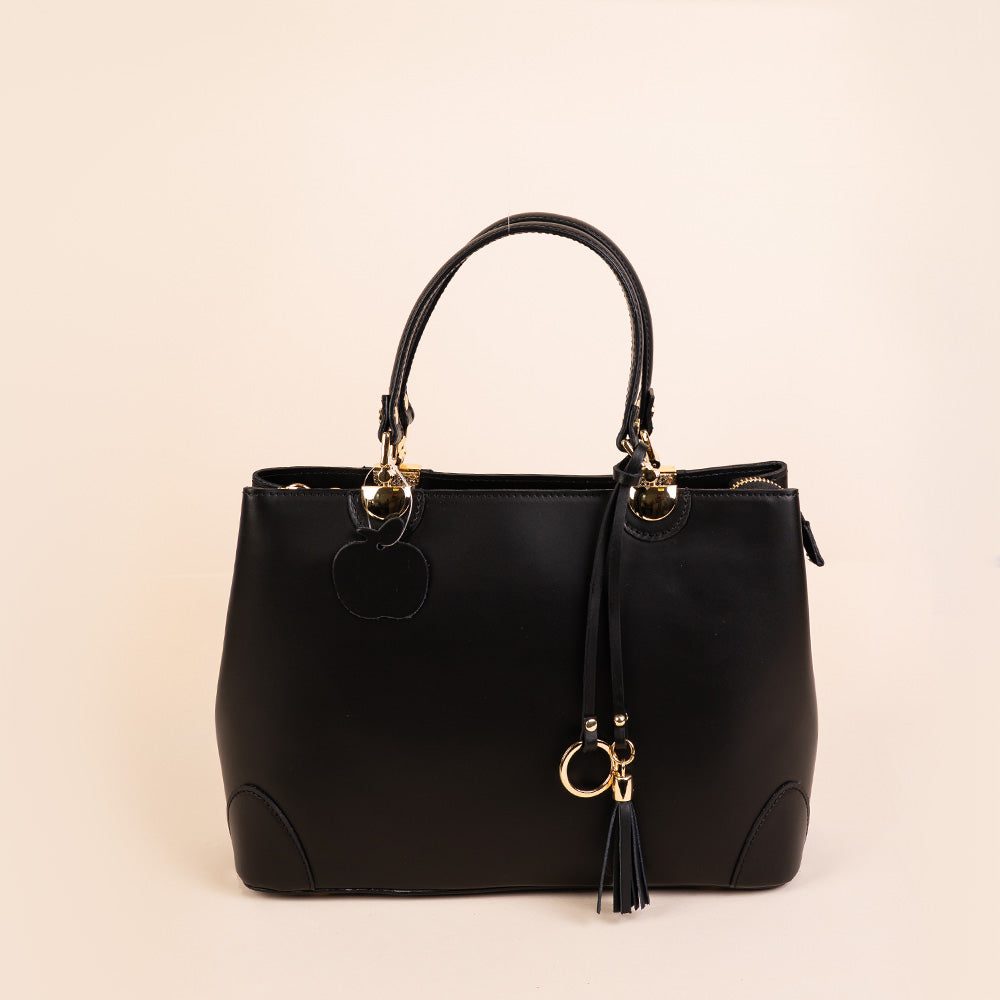 SEMI-RIGID HANDBAG WITH CORNER PROTECTORS AND TASSEL