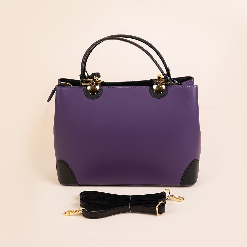 SEMI-RIGID HANDBAG WITH CORNER PROTECTORS AND TASSEL