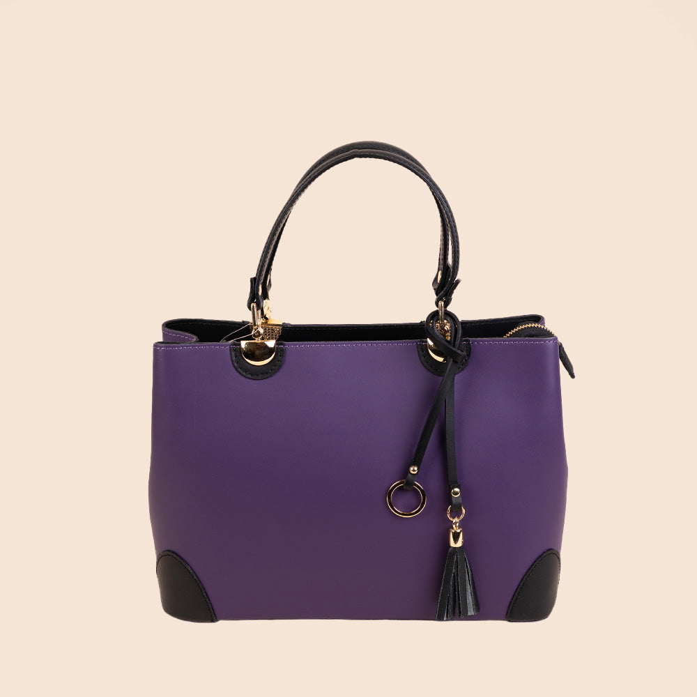 SEMI-RIGID HANDBAG WITH CORNER PROTECTORS AND TASSEL