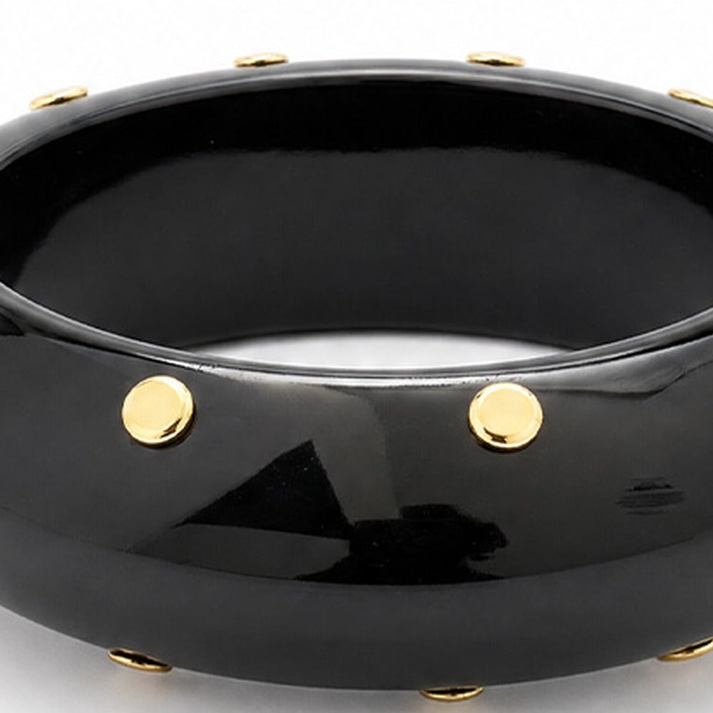 BRACCIALE RIGIDO CHIUSO CON BORCHIE AI LATI