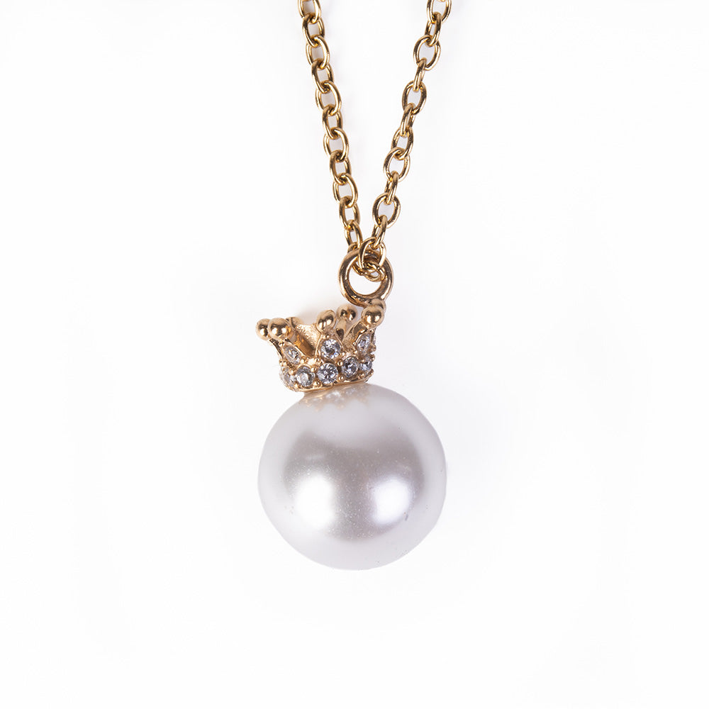 PEARL CHOKER NECKLACE HANGING ON A RHINESTONE CROWN