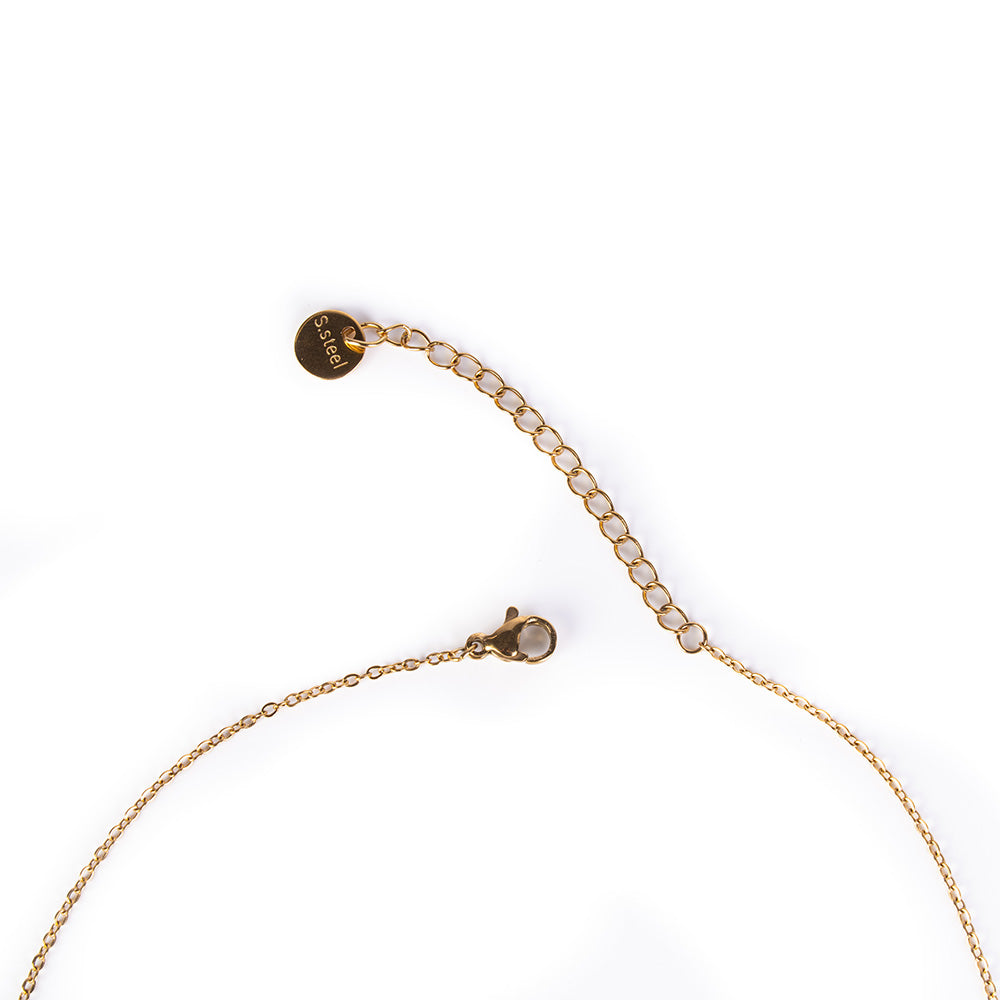 PEARL CHOKER NECKLACE HANGING ON A RHINESTONE CROWN