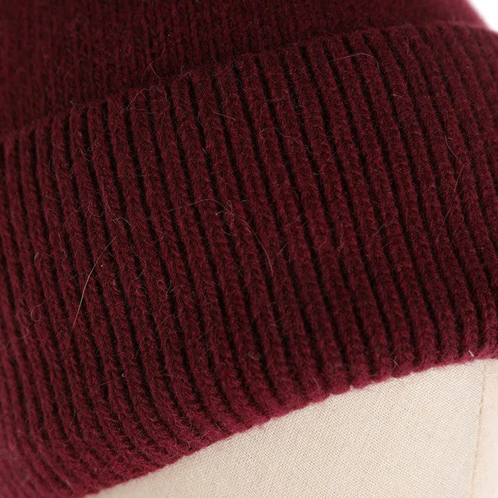 CAPPELLO A CUFFIA CON PON PON IN PELLICCIA