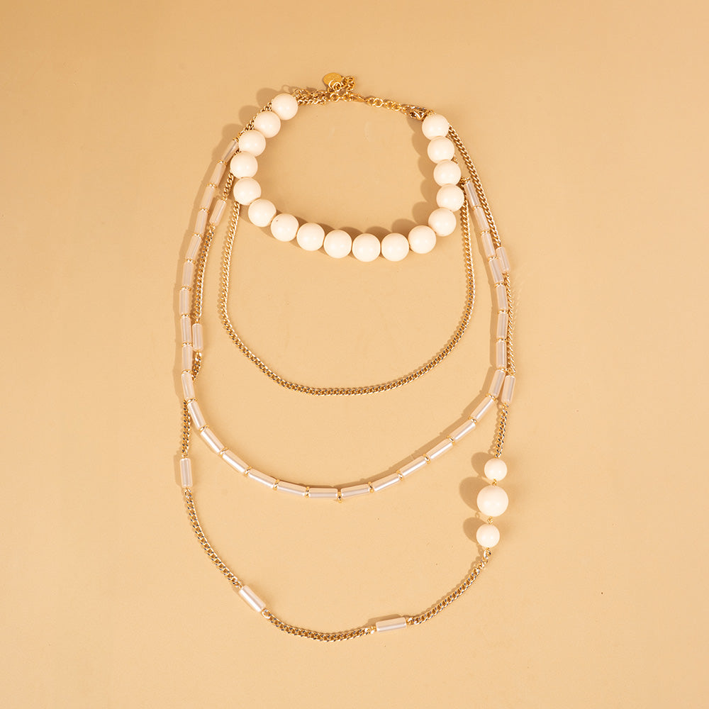 COLLANA LUNGA CON SFERE E CATENE