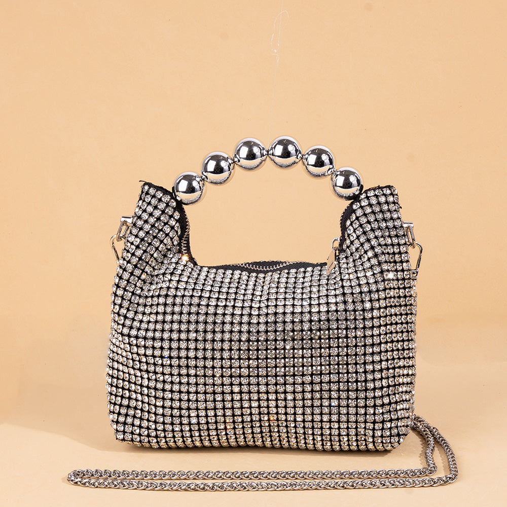 HANDBAG MODEL WITH RHINESTONE AND SPHERES ON THE HANDLE