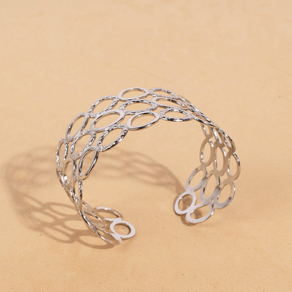 BRACCIALE RIGIDO A FASCIA CON TRE FILE DI ANELLI