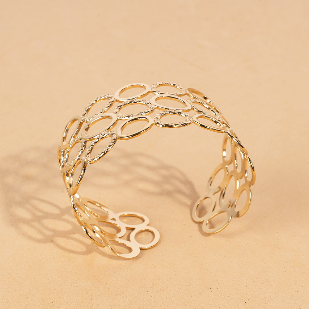 BRACCIALE RIGIDO A FASCIA CON TRE FILE DI ANELLI