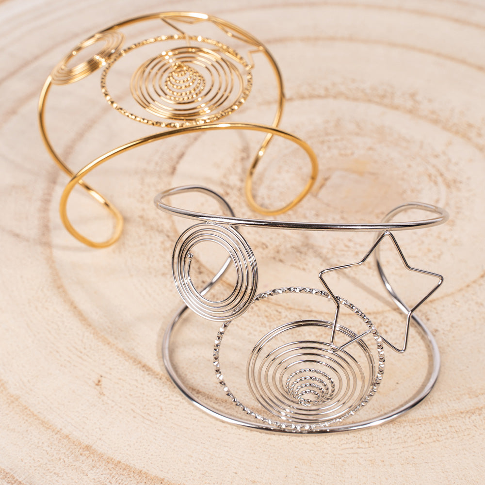 BRACCIALE RIGIDO A FASCIA CON SPIRALI E UNA STELLA