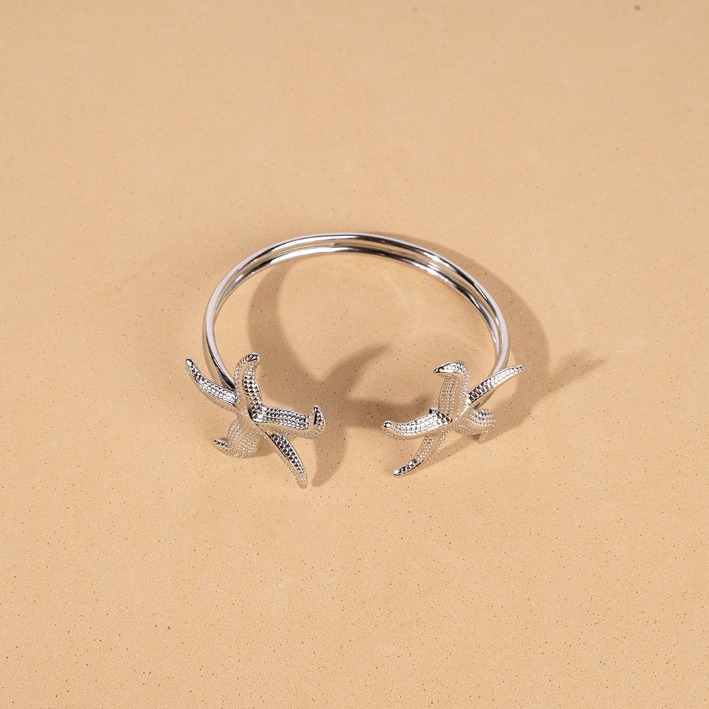 BRACCIALE RIGIDO APERTO CON DOPPIA STELLA MARINA