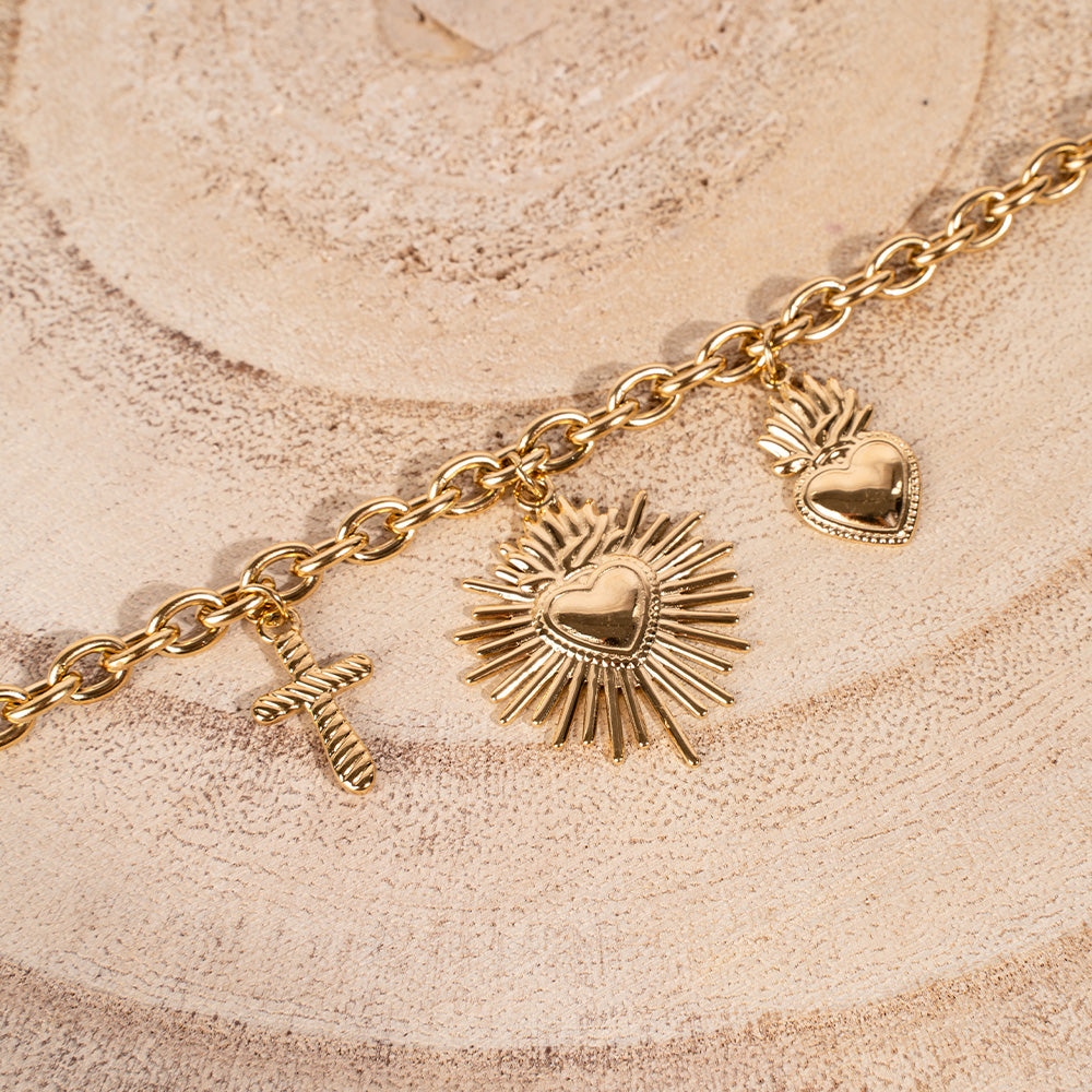 BRACCIALE MORBIDO CON DUE CUORI SACRI E CROCE PENDENTE