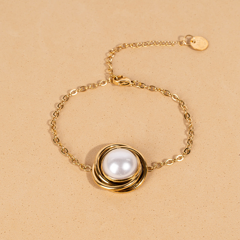 BRACCIALE CON DECORAZIONE CIRCOLARE E PERLA