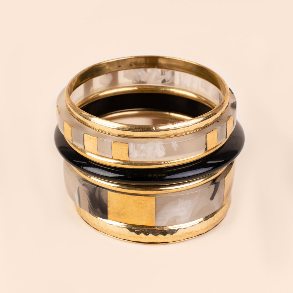 BRACCIALE RIGIDO COMPOSTO DA PIU' PEZZI IN DIVERSI COLORI E MATERIALI