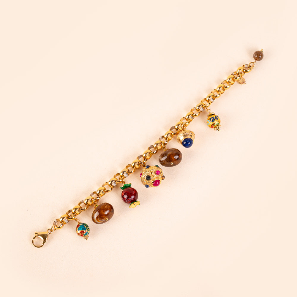 BRACCIALE CON CIONDOLI VARI E PIETRE