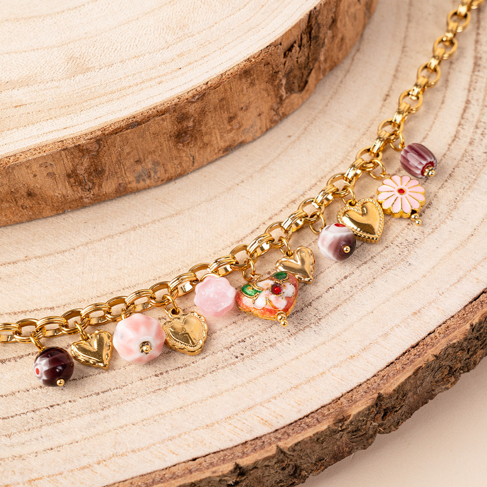 BRACCIALE CON CIONDOLI VARI FIORI E PIETRE