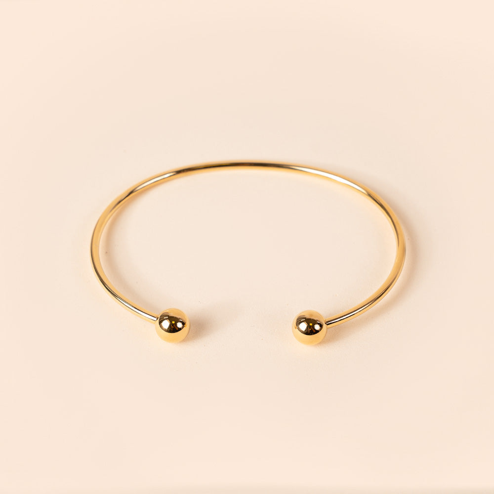 ADJUSTABLE RIGID BRACELET WITH SPHERES AT THE ENDS