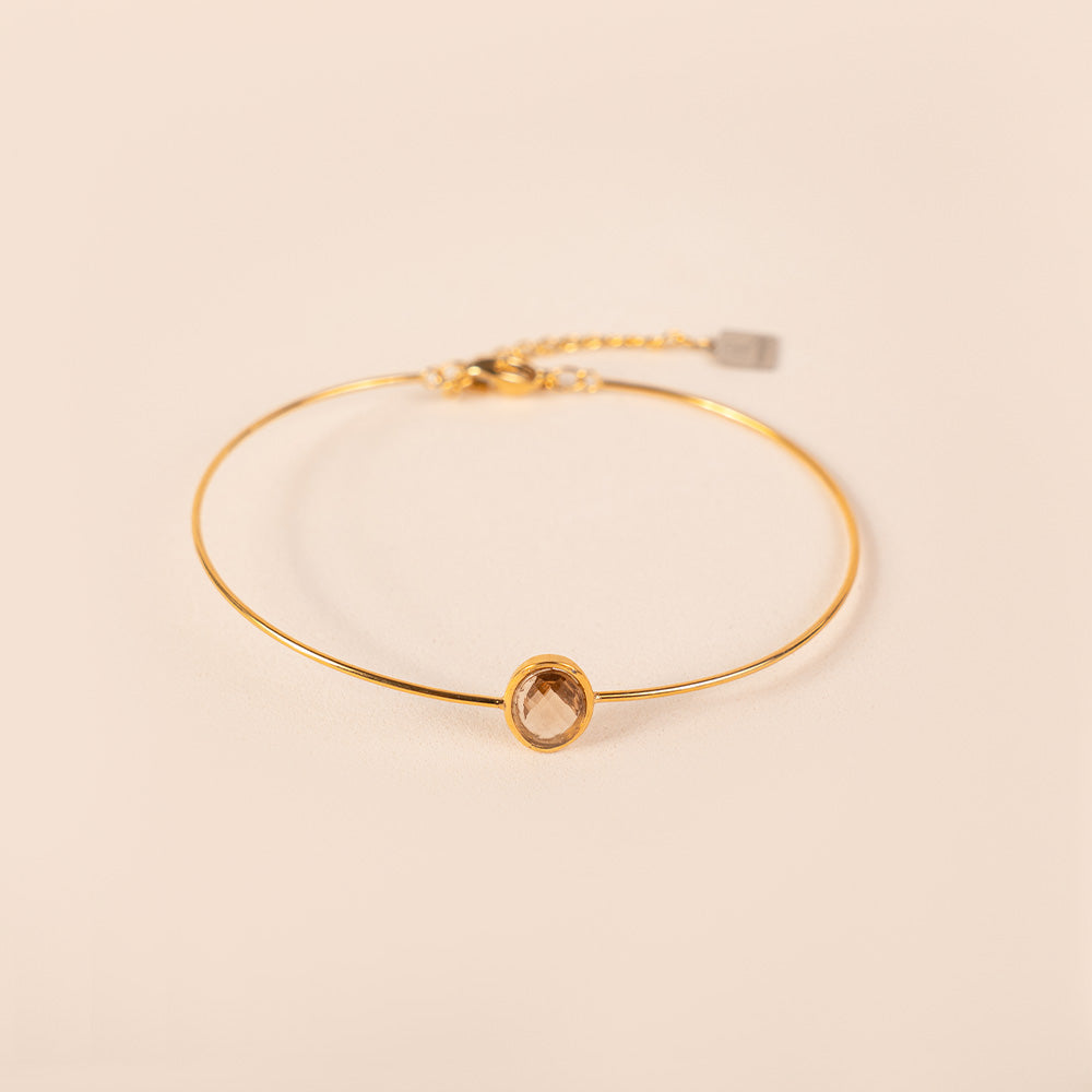 BRACCIALE RIGIDO FINO CON PIETRA OVALE CENTRALE
