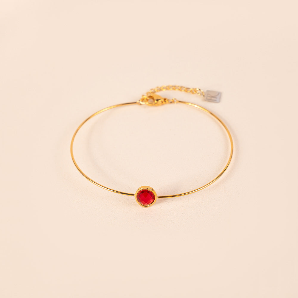 BRACCIALE RIGIDO FINO CON PIETRA OVALE CENTRALE