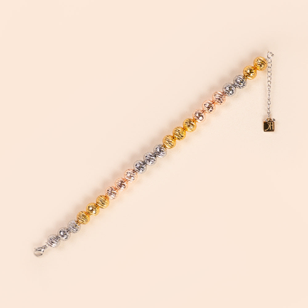 BRACCIALE CON SFERE RIGATE A COLORI ALTERNATI