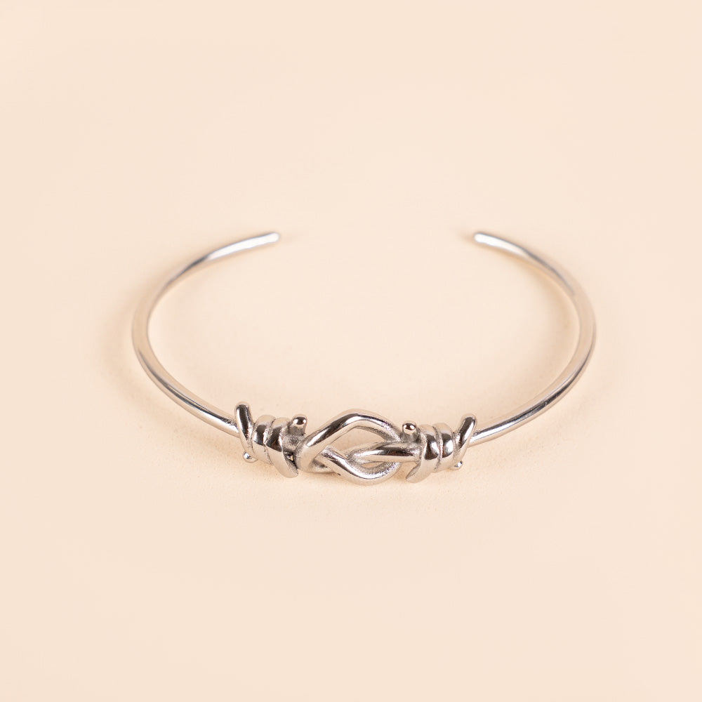 BRACCIALE RIGIDO CON FILO SPINATO E NODO A CUORE