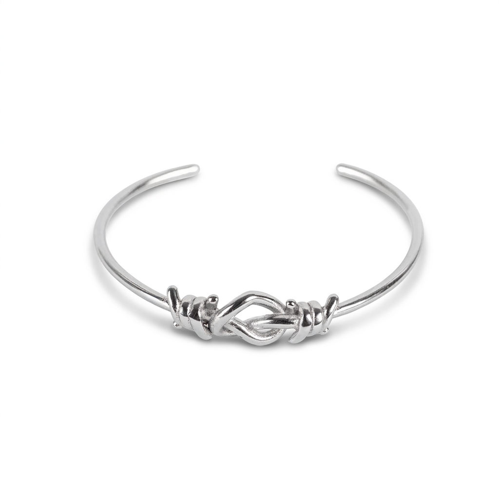 RIGID BRACELET WITH BARBED WIRE AND HEART KNOT