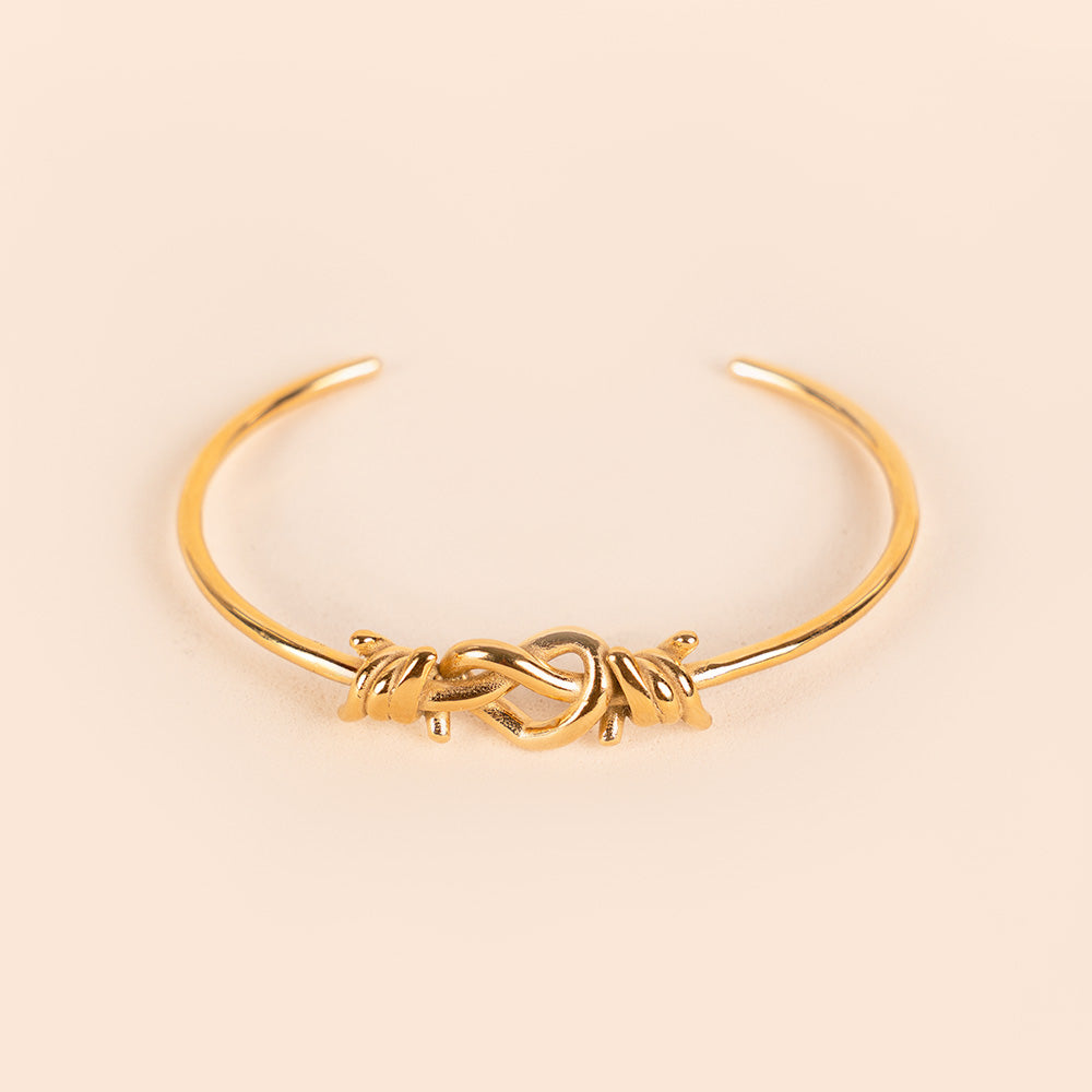 BRACCIALE RIGIDO CON FILO SPINATO E NODO A CUORE