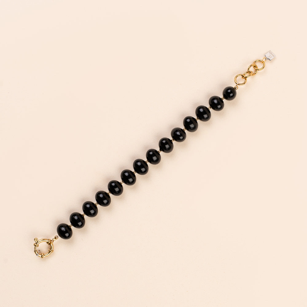 BRACCIALE CON PERLE OVALI LUCIDE INTERVALLATE DA PUNTI DORATI