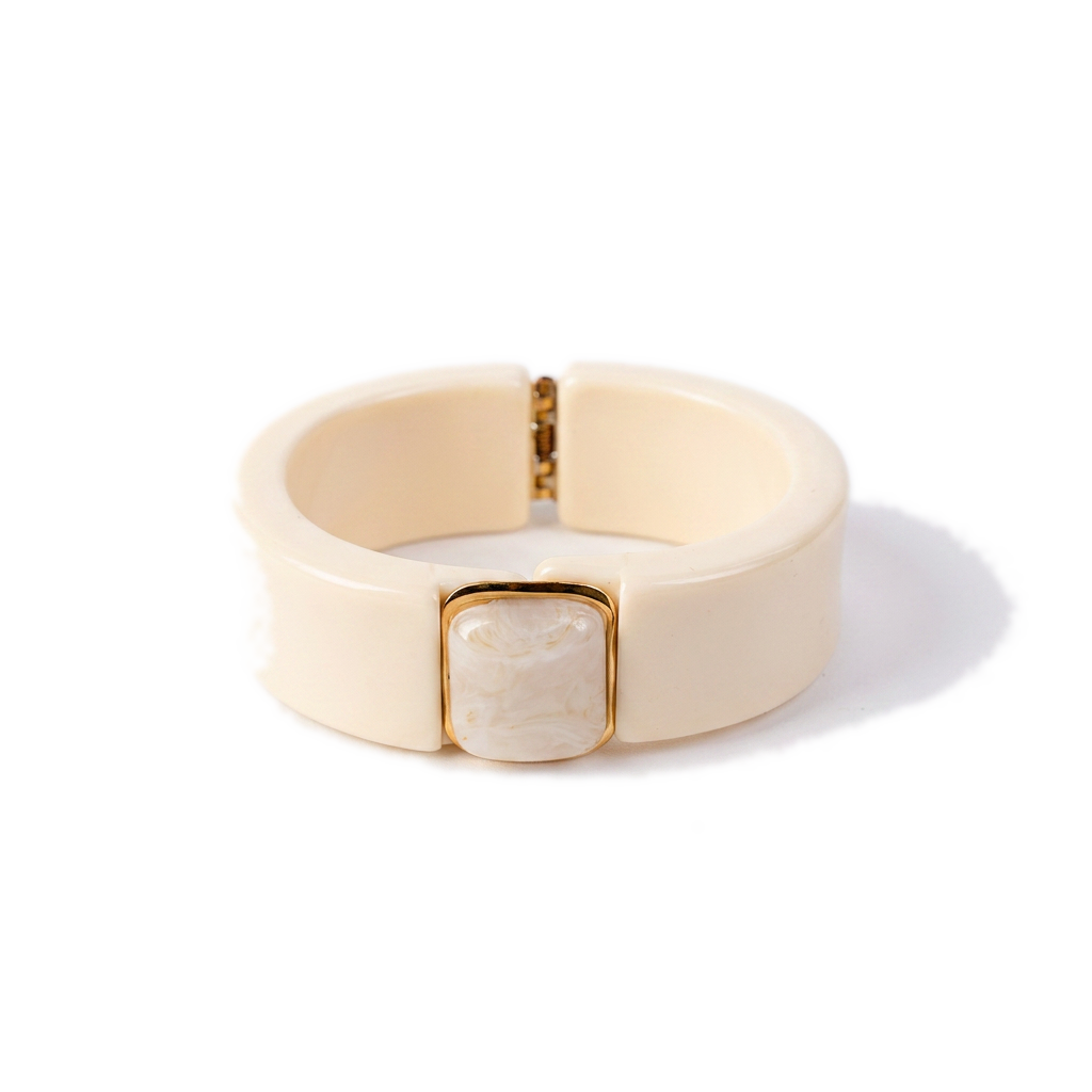 BRACCIALE RIGIDO IN RESINA CON APERTURA A MOLLA E PIETRA CENTRALE