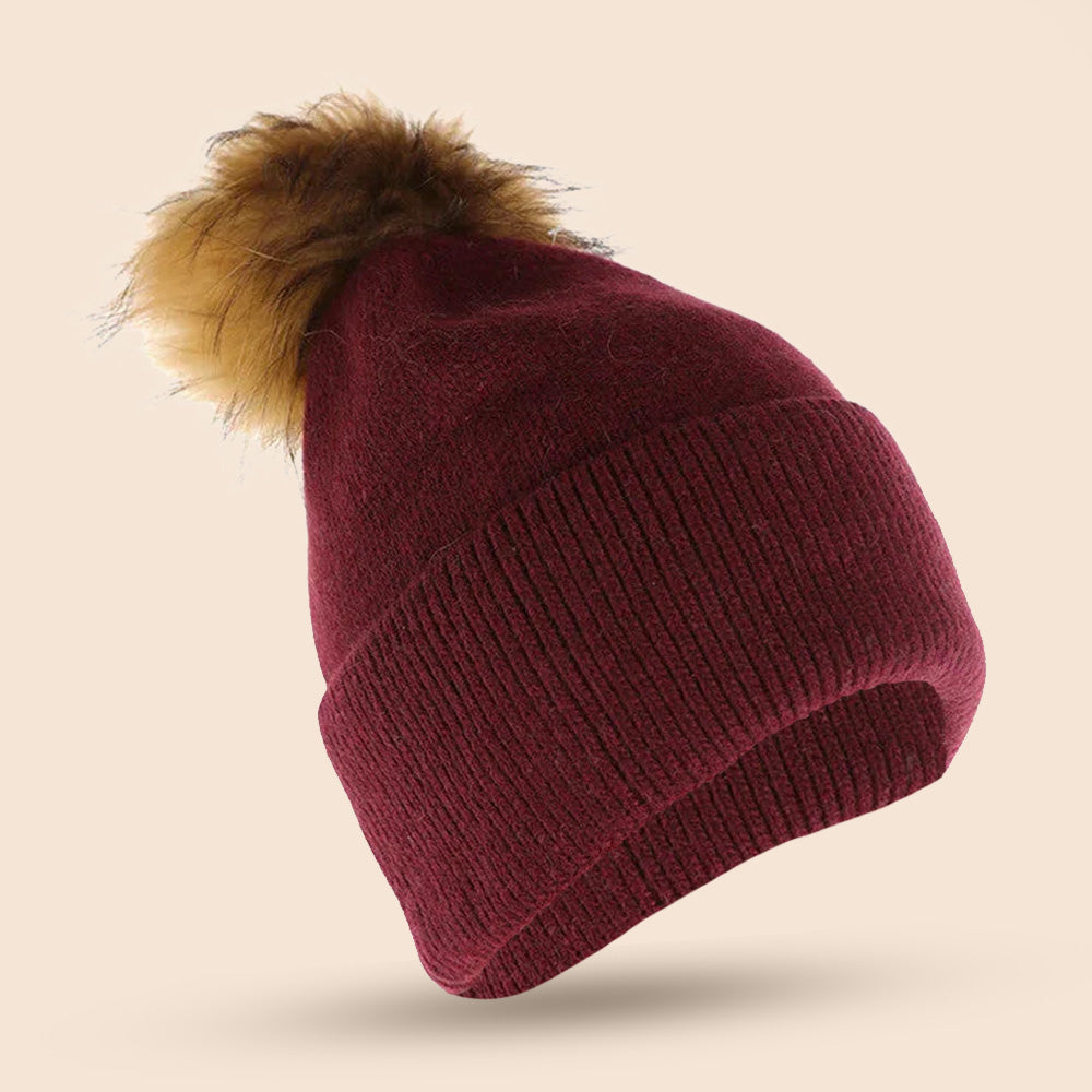 CAPPELLO A CUFFIA CON PON PON IN PELLICCIA