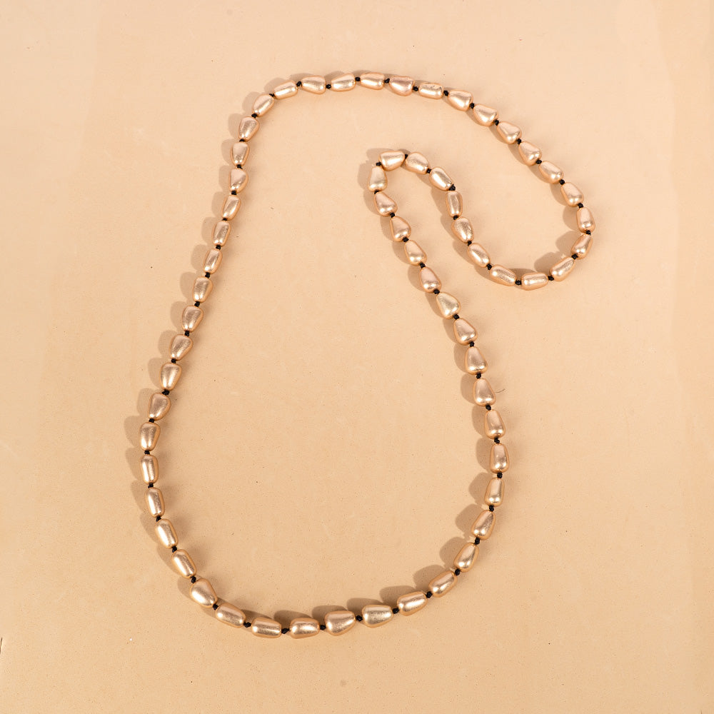 LONG NECKLACE WITH TRIANGLE INSERTS AND KNOTS