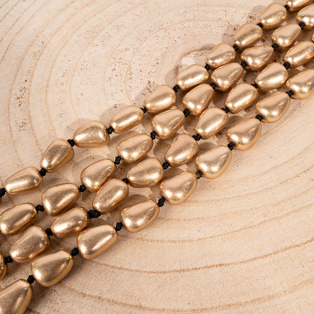 LONG NECKLACE WITH TRIANGLE INSERTS AND KNOTS