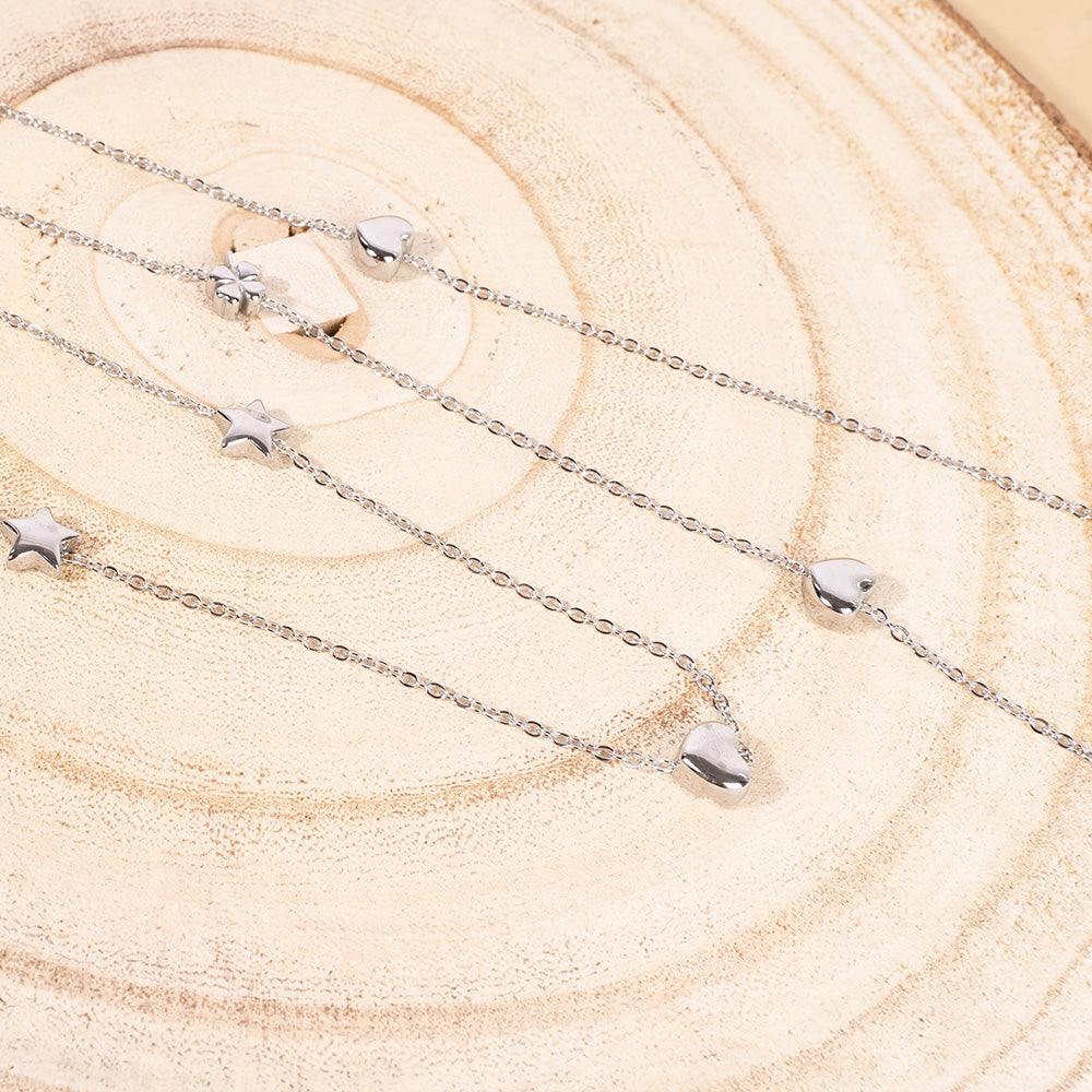 COLLANA LUNGA FINA CON LUNA CUORE STELLA E TRIFOGLIO