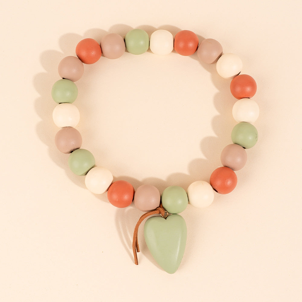 COLLANA ELASTICA CON SFERE E CUORE PENDENTE