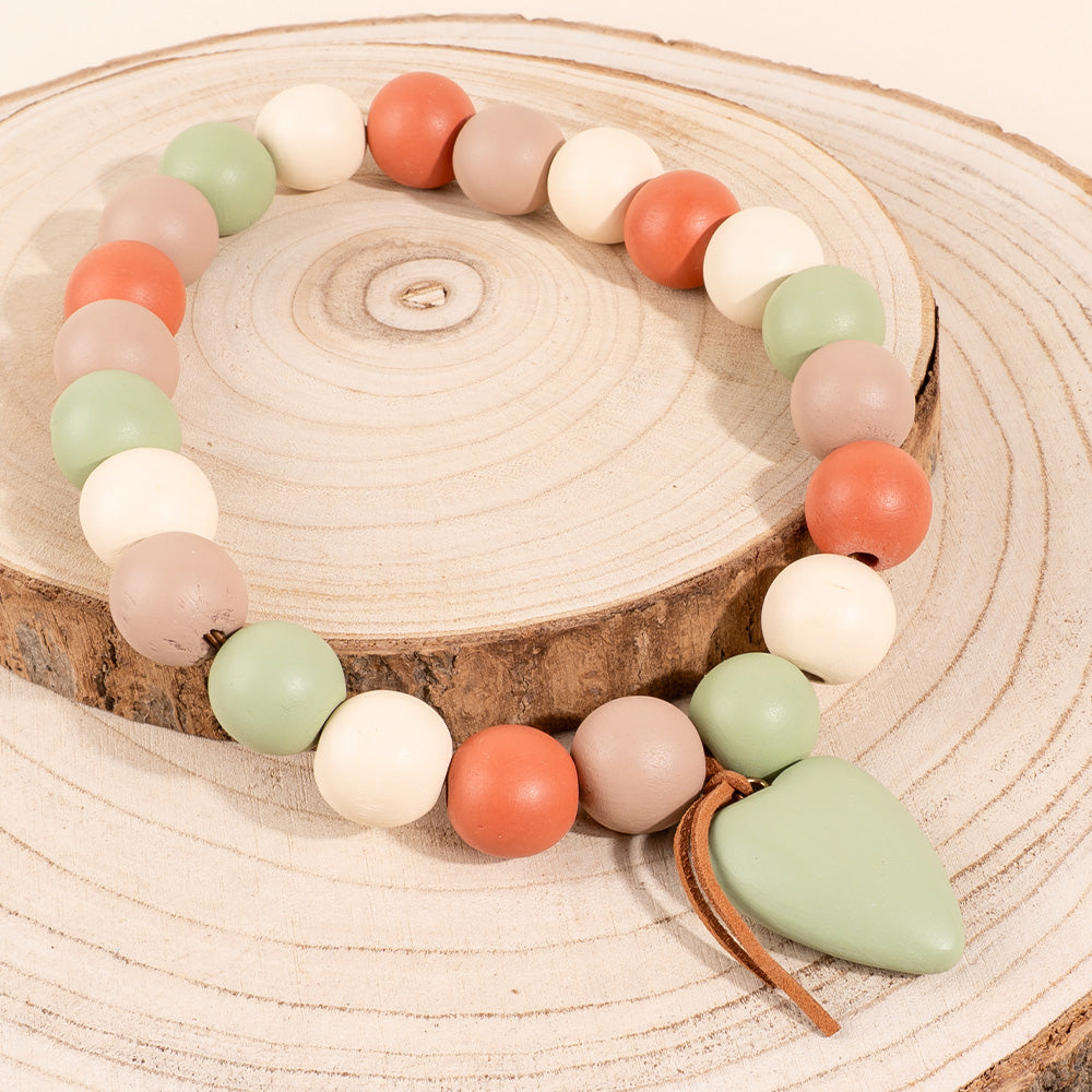 COLLANA ELASTICA CON SFERE E CUORE PENDENTE