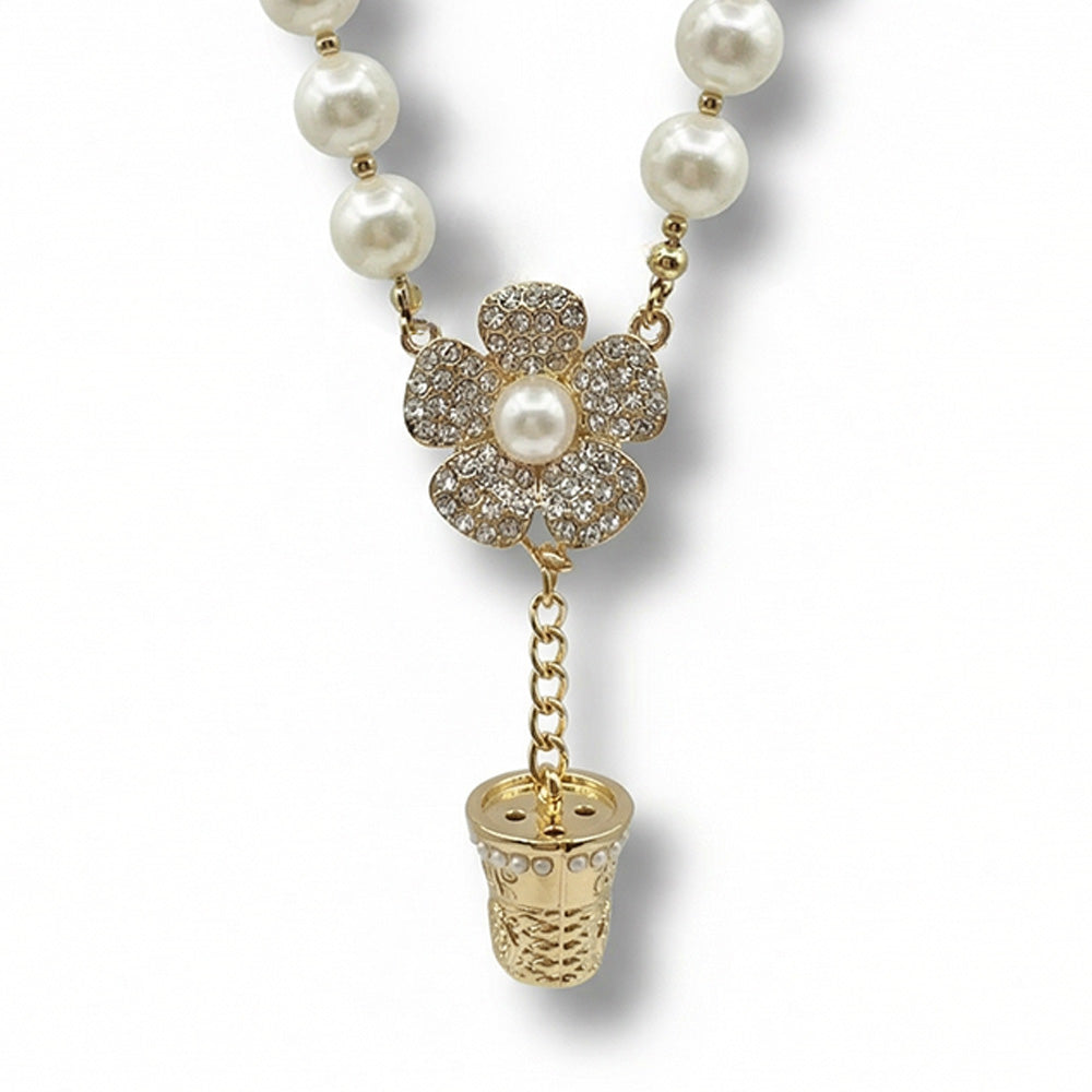 COLLANA GIROCOLLO CON PERLE E PENDENTI A FORMA DI FIORE E DITALE