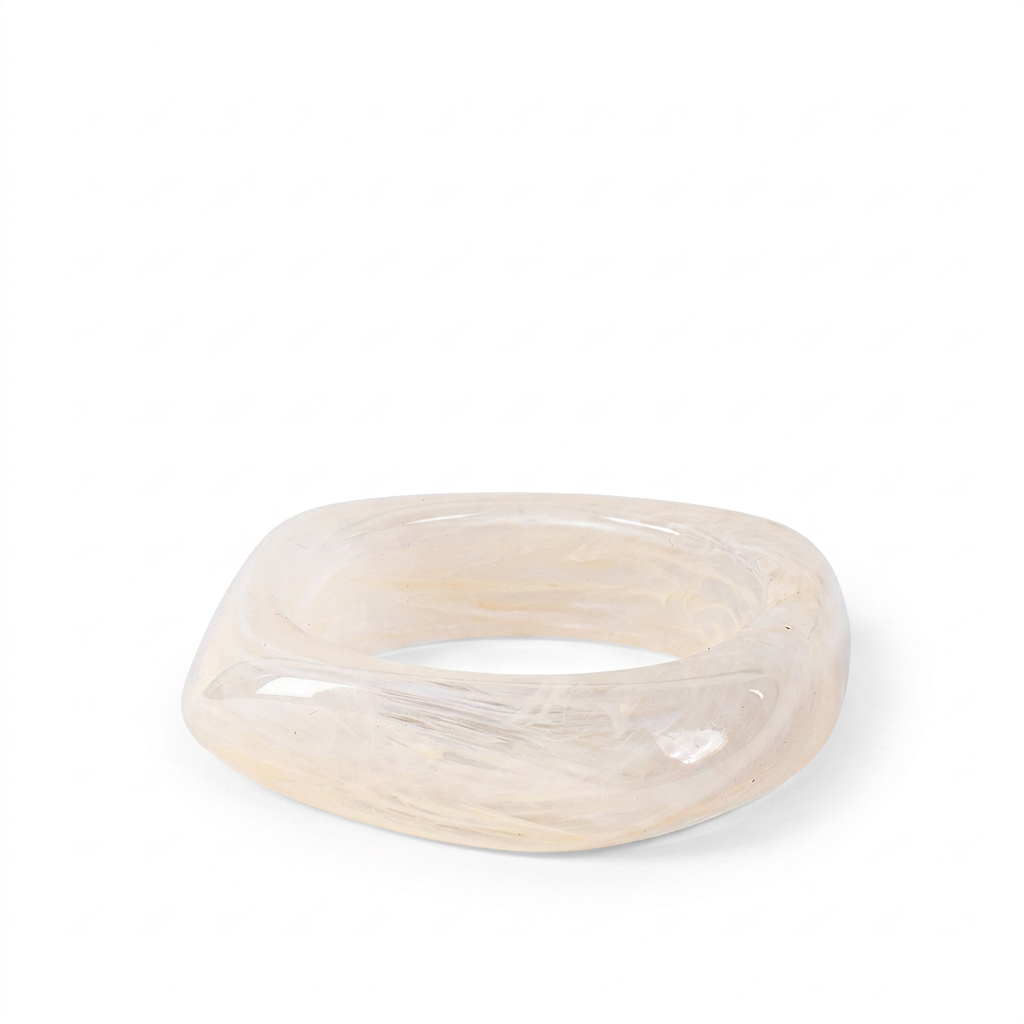 RIGID BRACELET OFTEN WITH AN IRREGULAR SHADE