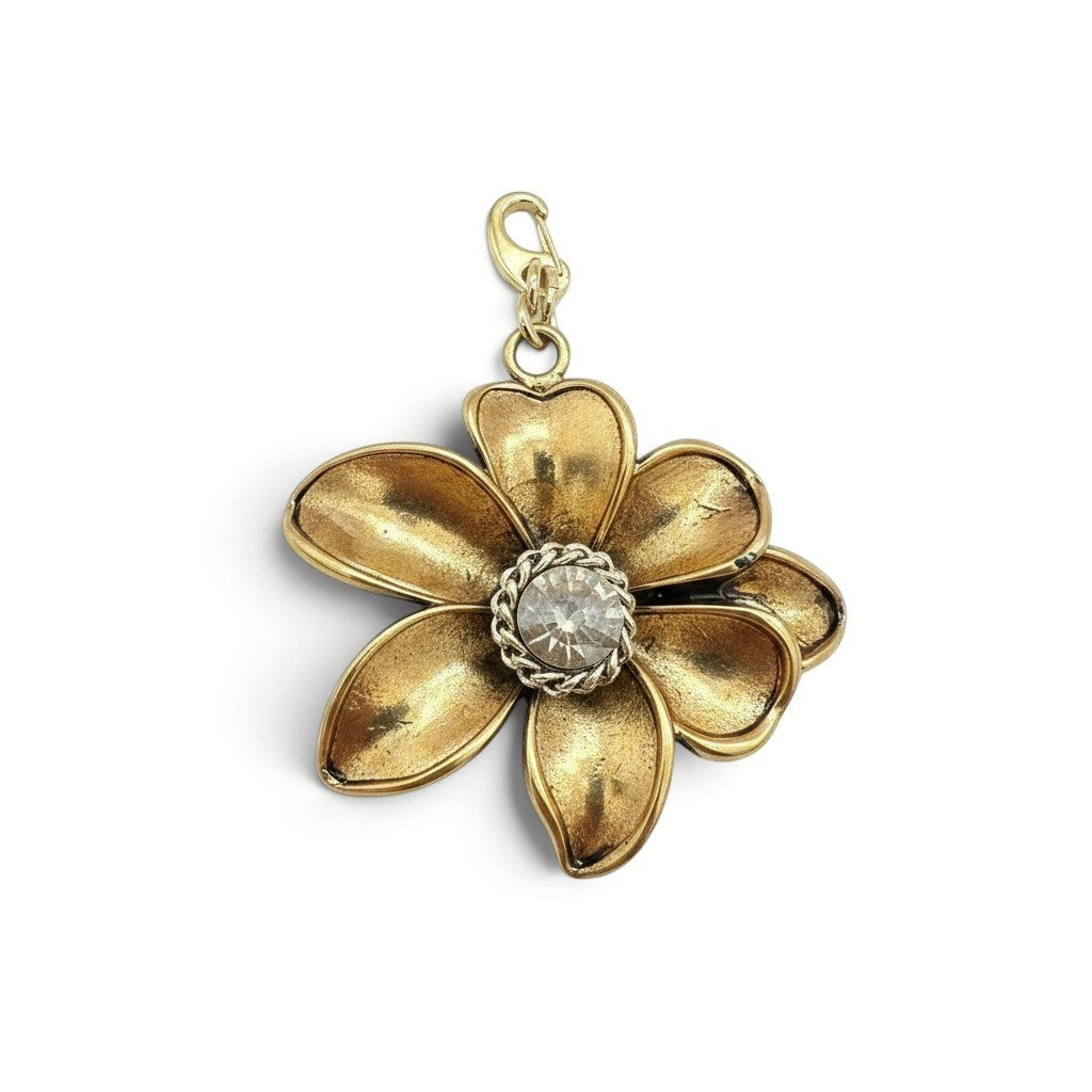 Charm a fiore Fanatikerie color oro con petali sagomati e cristallo centrale luminoso, dotato di moschettone