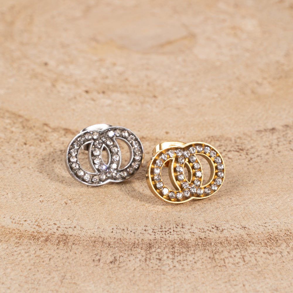 STUD EARRINGS WITH TWO TWISTED DISCS AND RHINESTONE