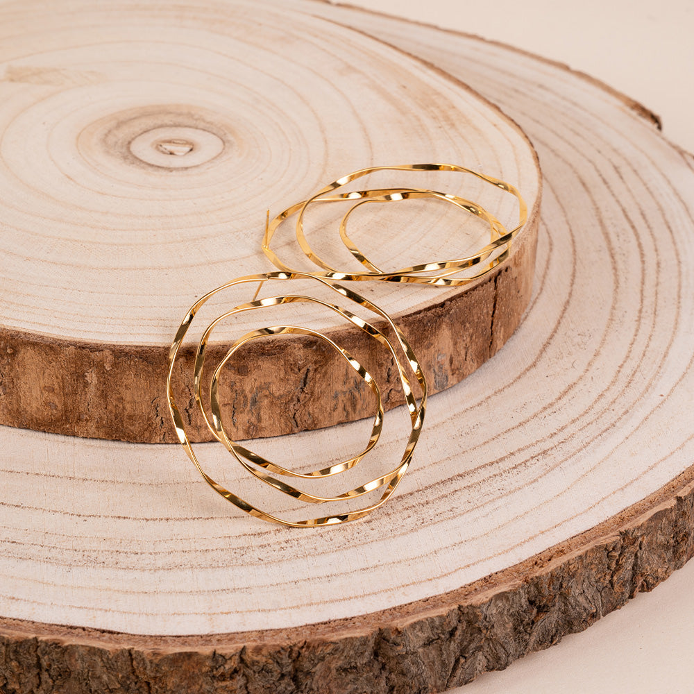 ORECCHINI PENDENTI A CERCHI MARTELLATI