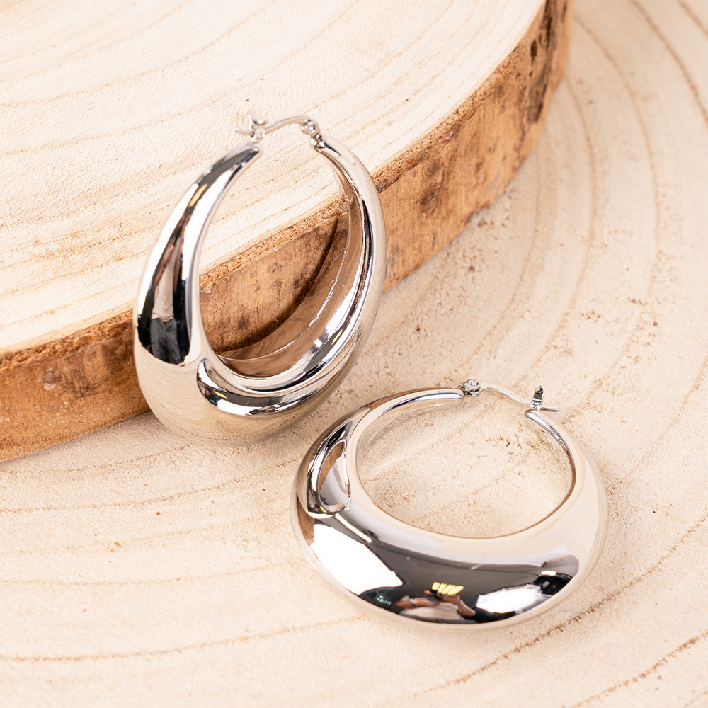 SMALL OVAL DANGLING EARRINGS WITH GRADUAL INCREASE