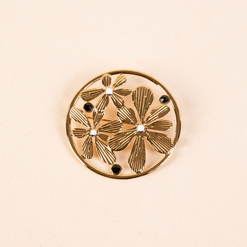 PIN WITH FLOWERS AND CIRCULAR FRAME
