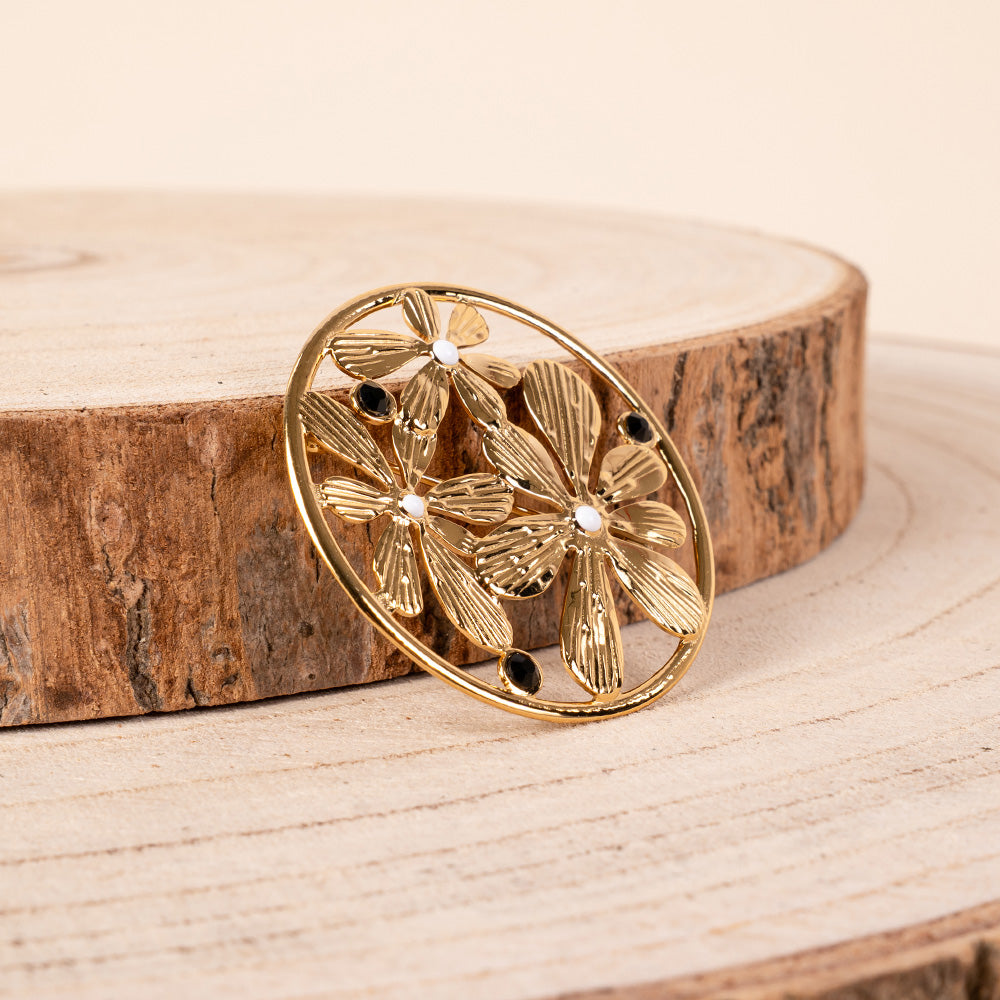 PIN WITH FLOWERS AND CIRCULAR FRAME