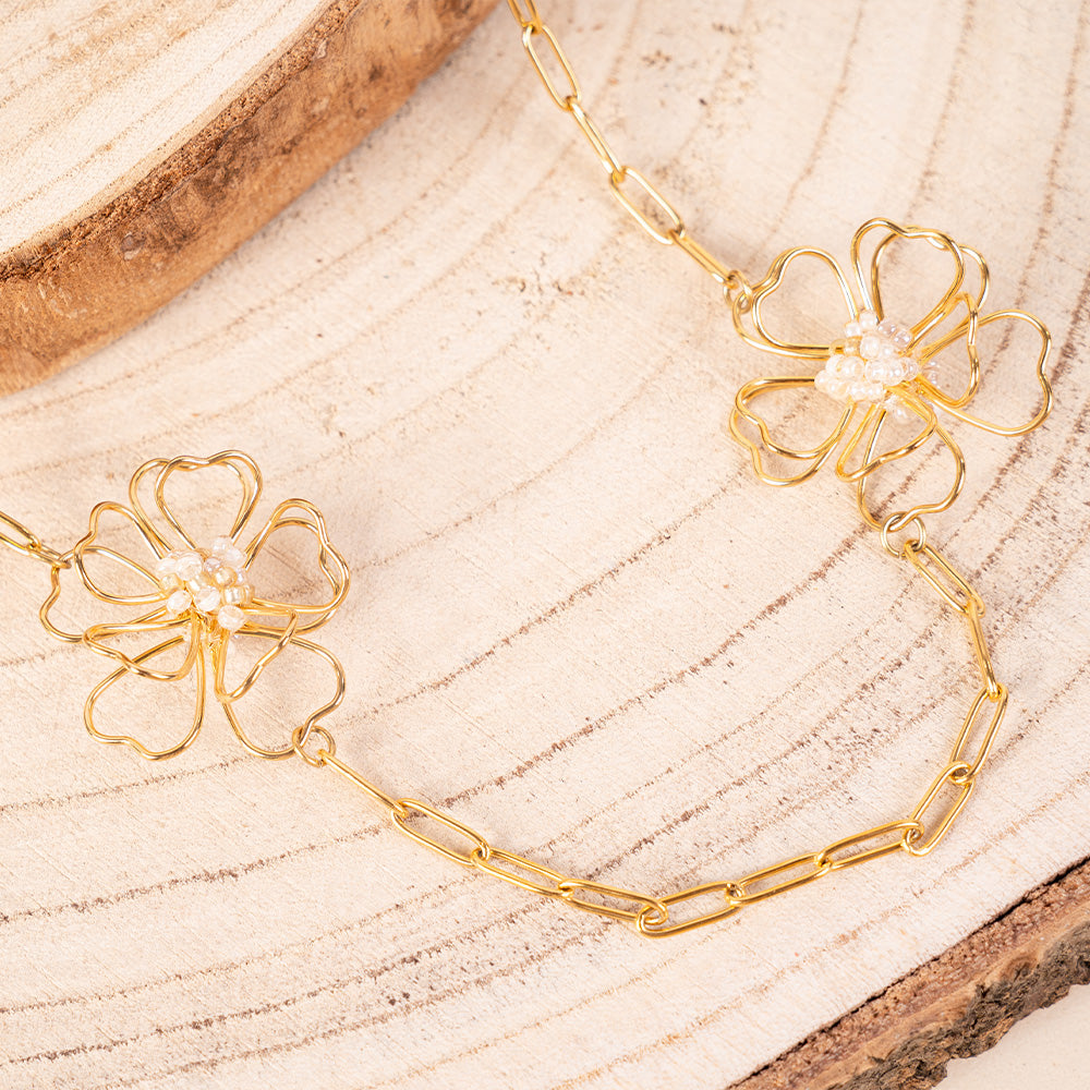 COLLANA LUNGA CON FIORI STILIZZATI