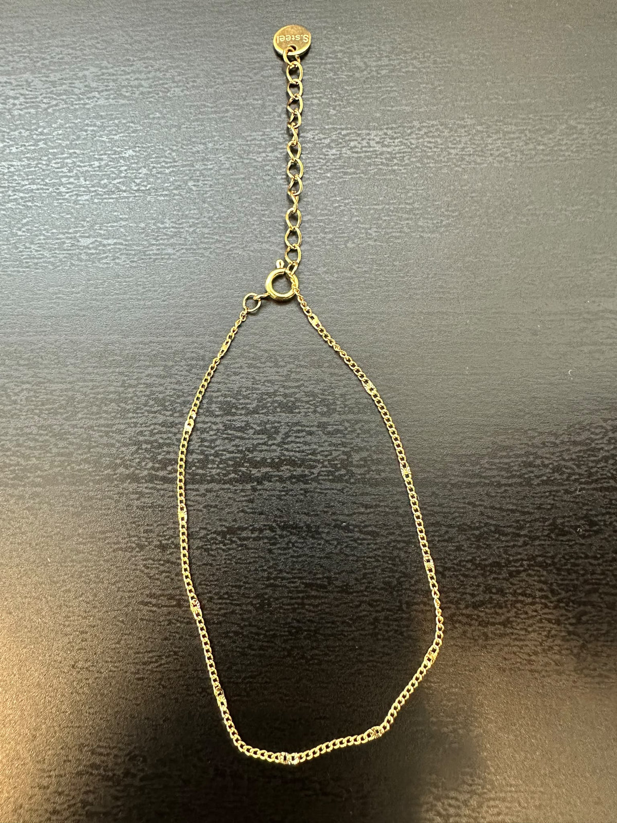 BRACCIALE A MAGLIA CLASSICA INTERROTTA DA PICCOLA PIASTRINA CON REGOLAZIONE