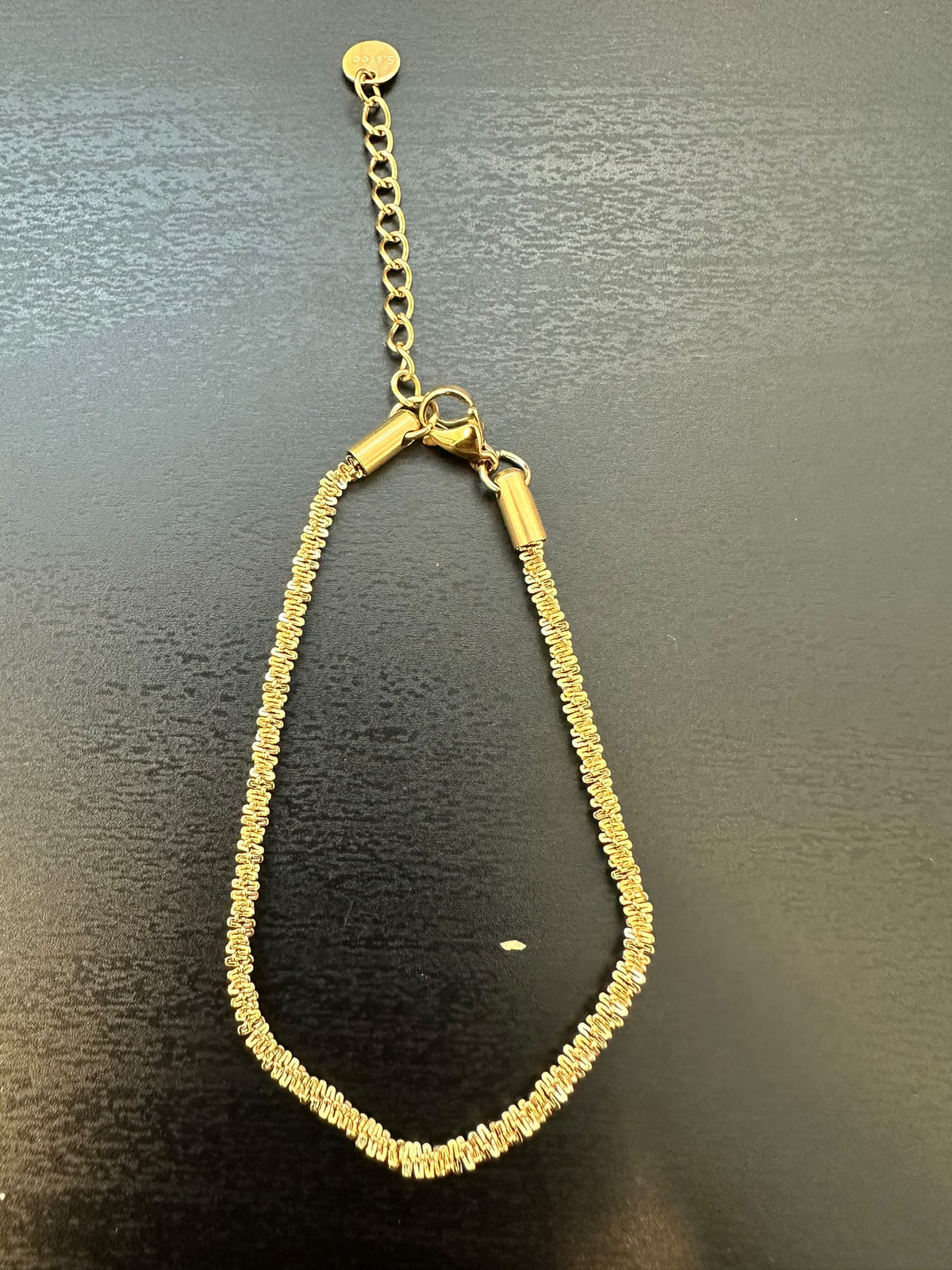 BRACCIALE A MAGLIA ZIG ZAG RITORTA CON TERNIMALI CILINDRICI