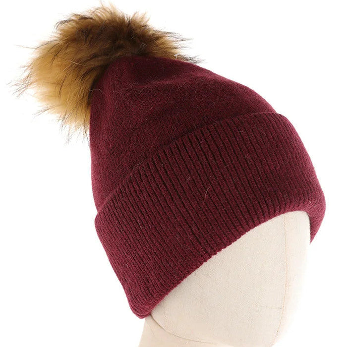 CAPPELLO A CUFFIA CON PON PON IN PELLICCIA