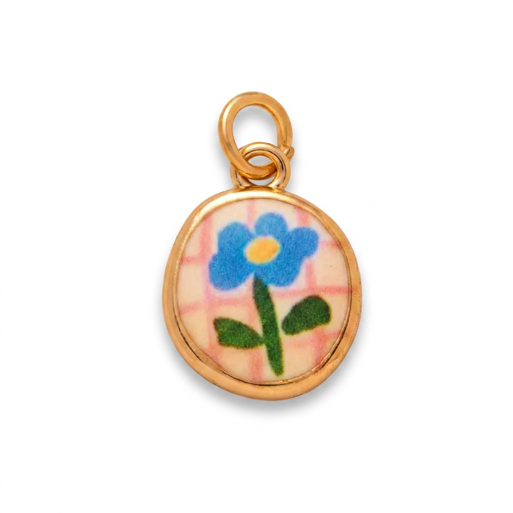 CHARM TONDO FIORE SMALTATO IN ACCIAIO PLACCATO ORO