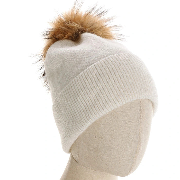 CAPPELLO A CUFFIA CON PON PON IN PELLICCIA