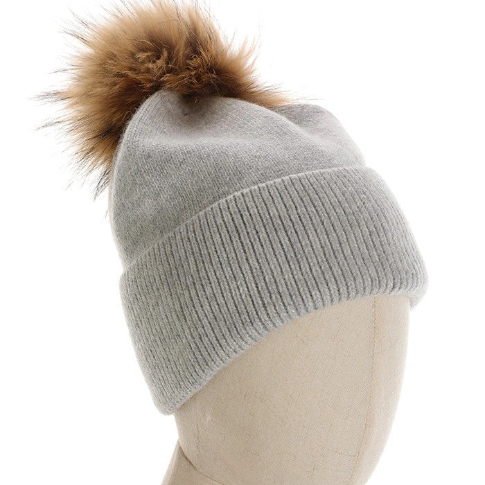 CAPPELLO A CUFFIA CON PON PON IN PELLICCIA