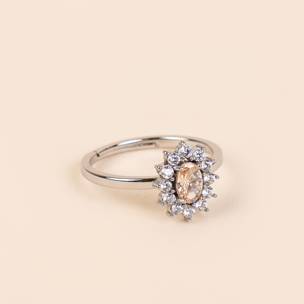 ADJUSTABLE RING WITH RHINESTONE-SURROUNDED LIGHT POINT